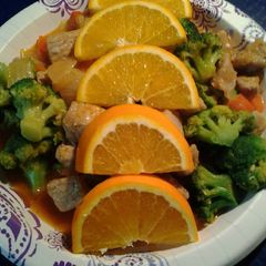 A picture of Pork a l'Orange with broccoli.
