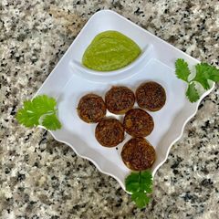 A picture of Achari ricotta stuffed mushrooms.