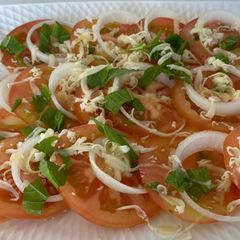 A picture of Tomoto Salad with Basil & Mozzarella Cheese.