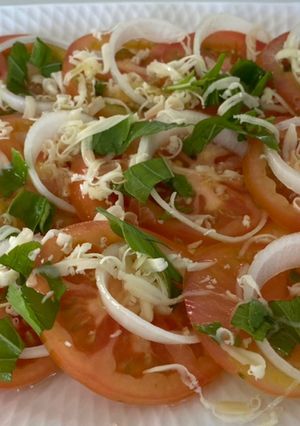 A picture of Tomoto Salad with Basil & Mozzarella Cheese.