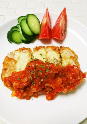 A picture of Pork Cutlet with Tomato Sauce and Cheese.