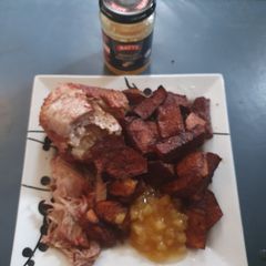 A picture of Boneless Pork joint with Apple sauce.