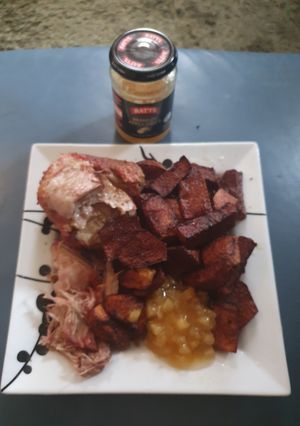 A picture of Boneless Pork joint with Apple sauce.