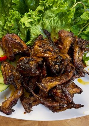 A picture of Lemongrass Saté Butter Quail.