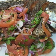 A picture of Fried fish with kachumbari.