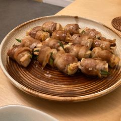 A picture of Pork rolls with tofu and mushrooms.