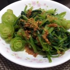 A picture of Chinese Spinach In Roasted Garlic And Soy Sauce.