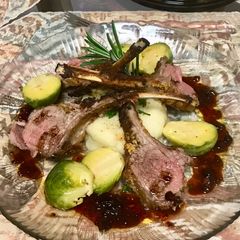 A picture of Grill rack of lamb with a red wine Balsamic vinaigrette sauce,.
