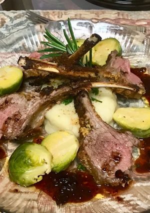 A picture of Grill rack of lamb with a red wine Balsamic vinaigrette sauce,.