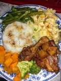 Homestyle chicken, mashed potatoes, candied yams and veggies