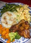 Homestyle chicken, mashed potatoes, candied yams and veggies