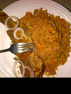 A picture of Jollof rice and fried fish.
