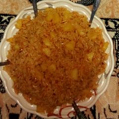 A picture of Jollof rice nd irish potato.