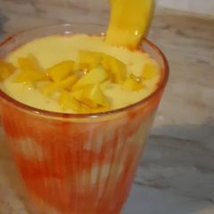 A picture of Mango shake with chunks.
