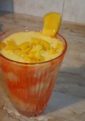 A picture of Mango shake with chunks.