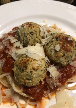 A picture of Eggplant meatballs with marinara.