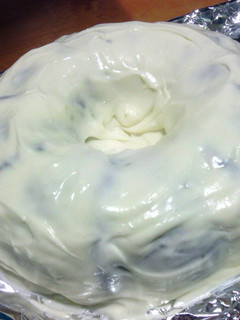 A picture of homemade spice cake and cream cheese frosting.