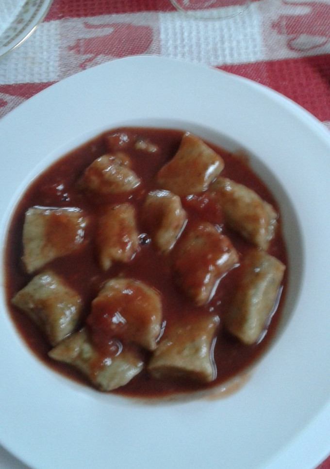 Una foto de Ñoquis con salsa fileto
