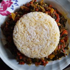 A picture of White Rice and Pasta with Vegetable Sauce.
