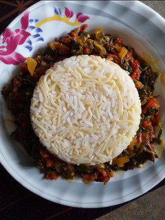 A picture of White Rice and Pasta with Vegetable Sauce.