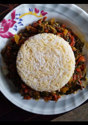 A picture of White Rice and Pasta with Vegetable Sauce.