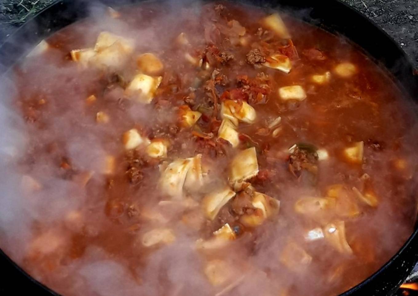 Ravioles de ricota con bolognesa al disco