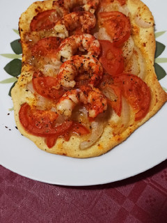 Una foto de Coca de gambones