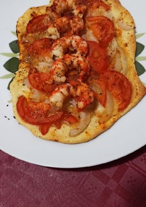Una foto de Coca de gambones