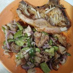 A picture of Creole Seasoned Pork Chop with Pepper Potato Hash.