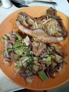 A picture of Creole Seasoned Pork Chop with Pepper Potato Hash.