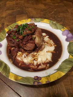 A picture of Brad's red wine braised ox tail w/ cauliflower puree.