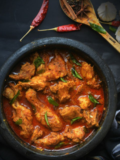 A picture of Chicken Ghee Roast curry.
