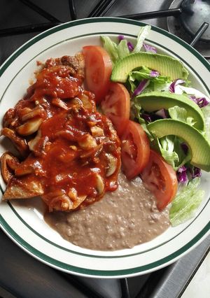Una foto de Chuletas en salsa de tomate con chipotle