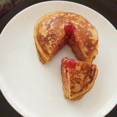 A picture of Vanilla flavoured,strawberry jam pancakes.