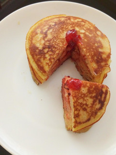 A picture of Vanilla flavoured,strawberry jam pancakes.