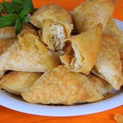 Mini Triangles Filled with Haloumi, Kasseri & Sunflower Seeds A picture of Mini Triangles Filled with Haloumi, Kasseri & Sunflower Seeds.