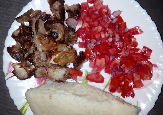 Oven roasted goat meat with ugali n kachumbari