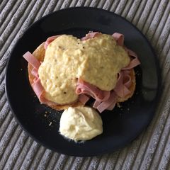 A picture of Scrambled eggs and bagel.