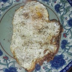 A picture of Fried Egg Bright Sunny Morning With Crispy Edges 🌞.