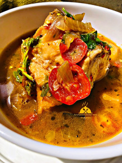 A picture of Fish pepper soup with potatoes and tomatoes.