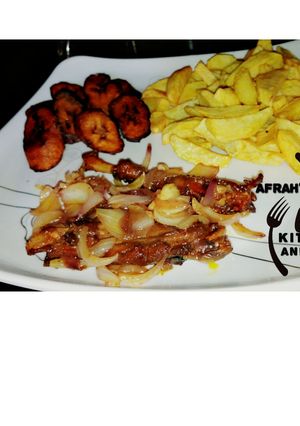 A picture of Fried Irish potatoes,plantain and oven baked chicken.