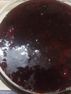 A picture of Strawberry and black grapes jam.