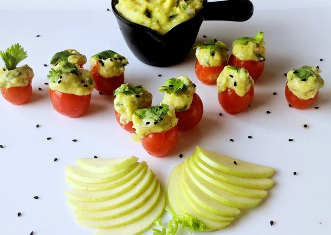 Cherry tomatoes stuffed with guacamole