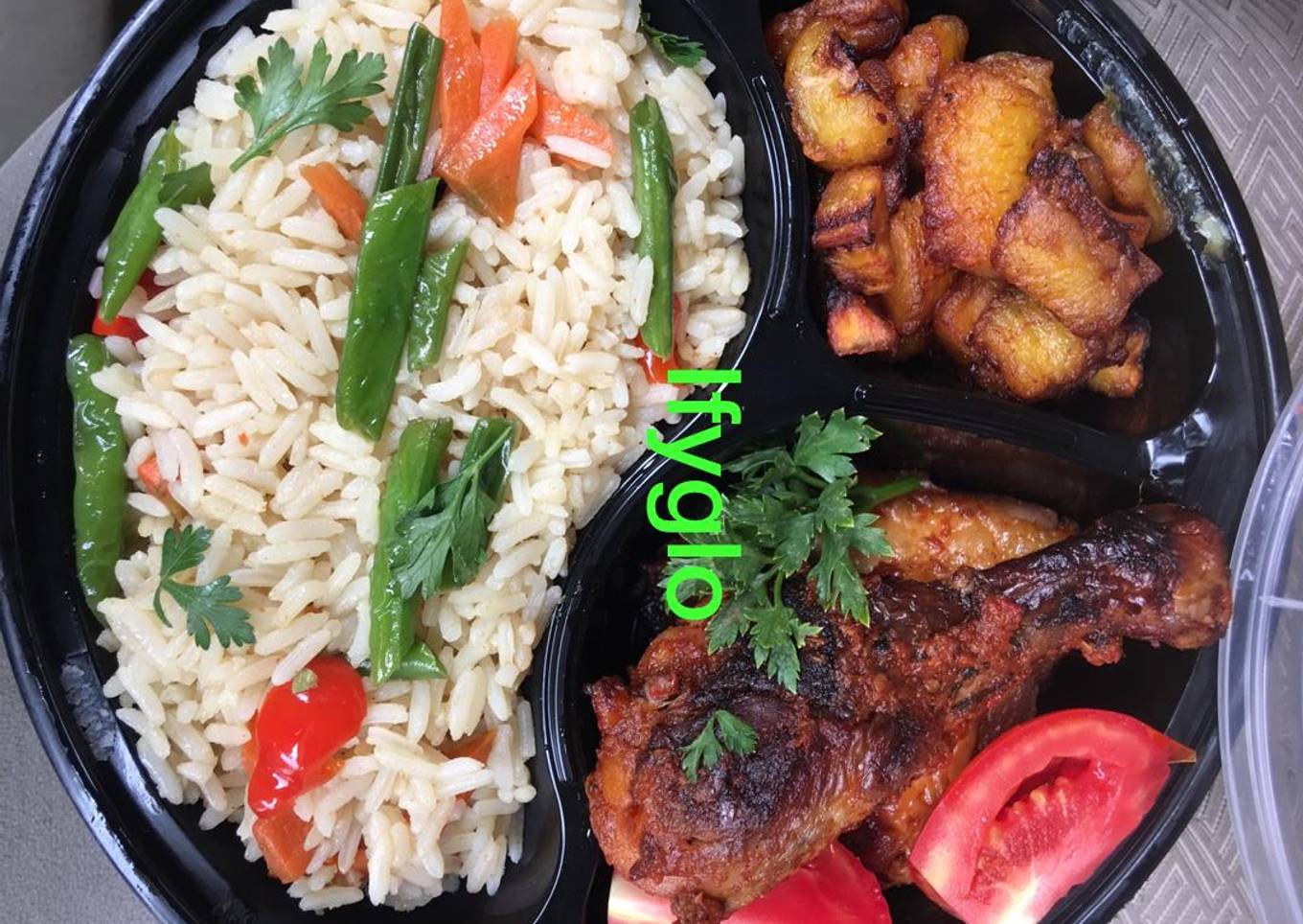 Rice,fried chicken and fried plantain