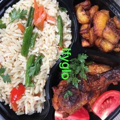 Rice,fried chicken and fried plantain A picture of Rice,fried chicken and fried plantain.