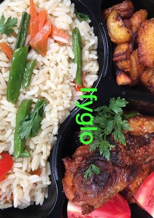 A picture of Rice,fried chicken and fried plantain.