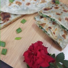 A picture of Jingalov hats Armenian herb stuffed flatbread .