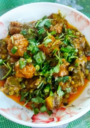 A picture of Baigun bodi(brinjal in dried lentil dumplings).