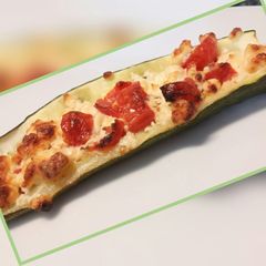 Feta and tomato stuffed courgettes A picture of Feta and tomato stuffed courgettes.