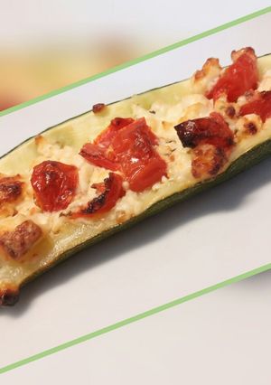 A picture of Feta and tomato stuffed courgettes.